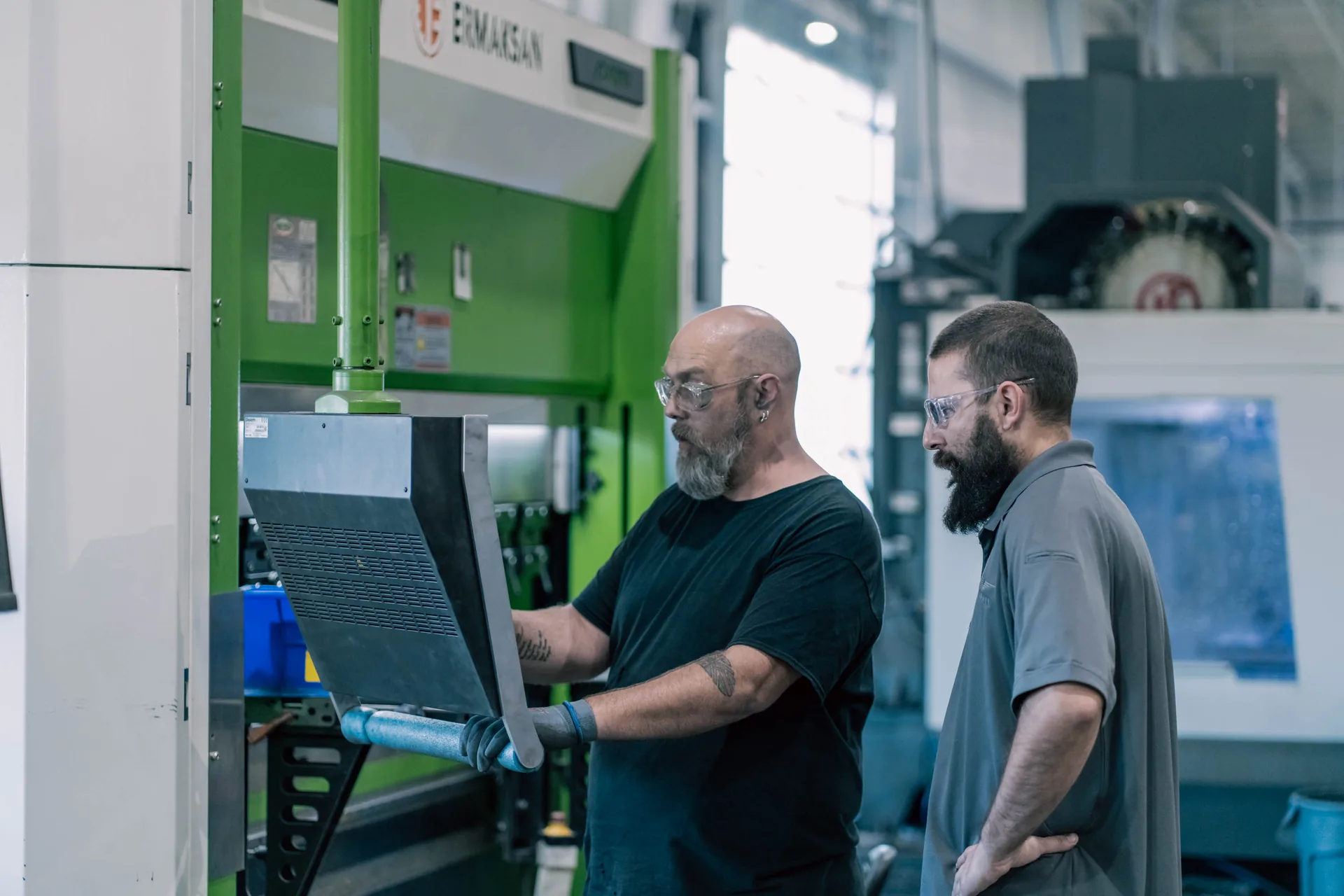 Operators at Ermaksan press brake, Goshen Manufacturing Company Goshen Indiana