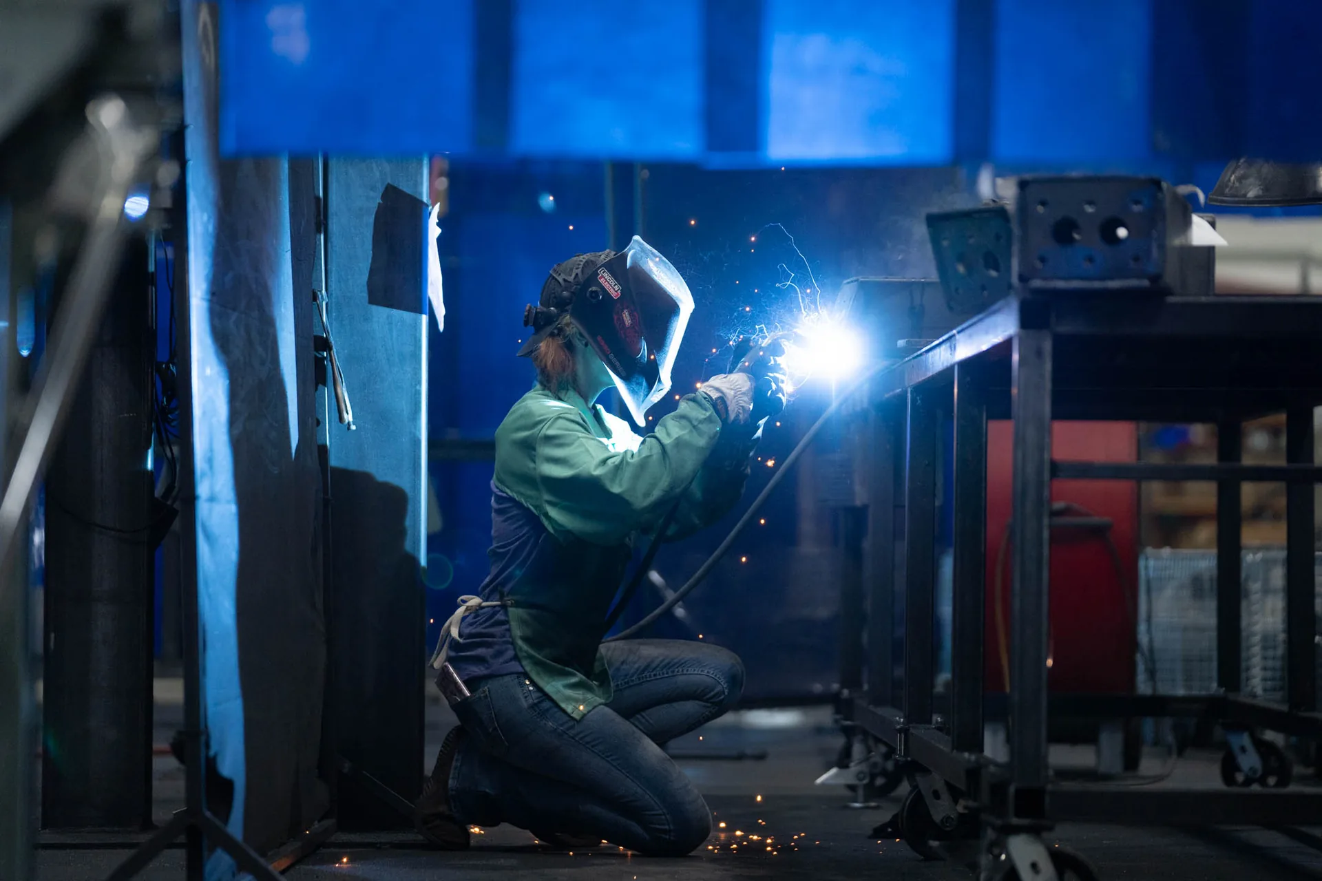 Welder MIG welding structural steel, Goshen Manufacturing Company